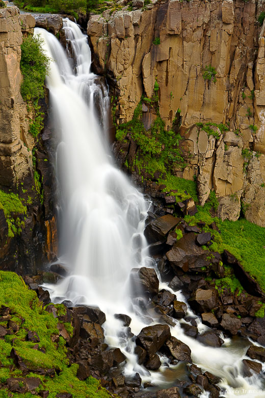 North Clear Creek plunges over a sheer rock cliff after meandering through North Clear Creek Park outside of Lake City, Colorado.