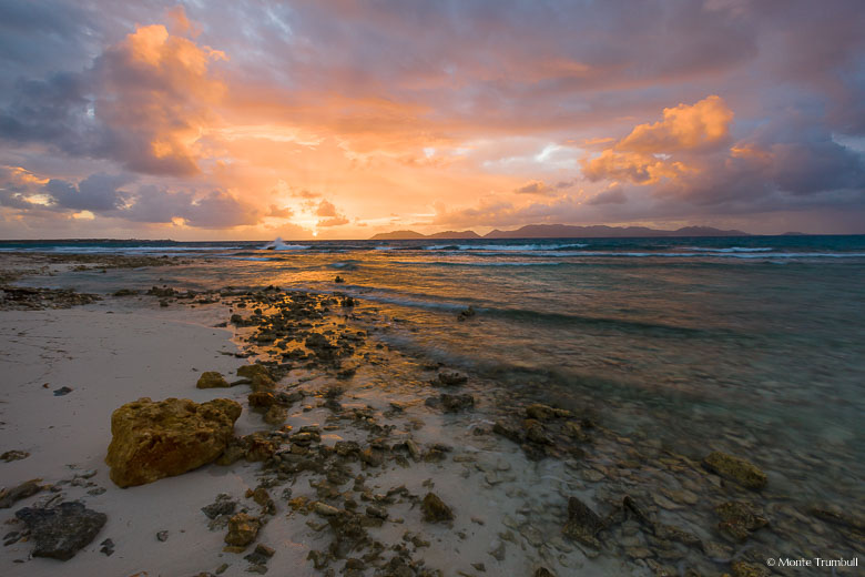 A gorgeous pastel colored sunrise over Merrywing Bay in Anguilla, BWI.