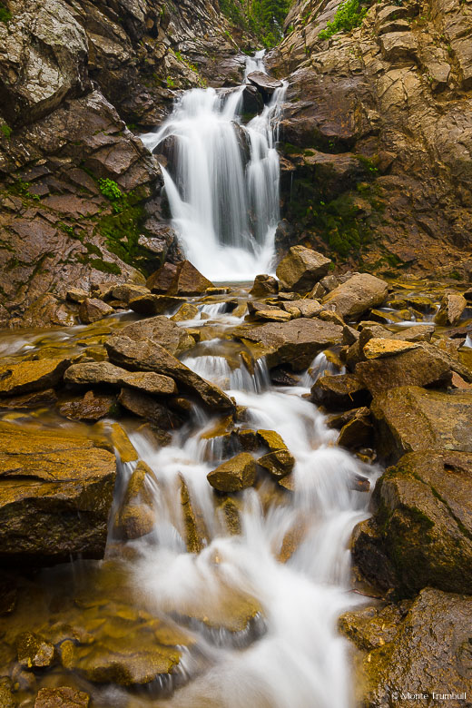 Middle Creek Falls flows at full force with water from melting snow pack outside of Crested Butte, Colorado.