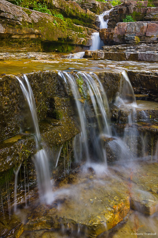 White Owl Creek flows over a rock ledge in the Flat Tops area of western Colorado.