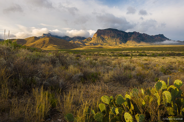 Clouds lift over the Chisos Mountains at sunrise in Big Bend National Park in Texas.