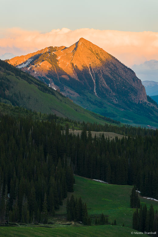 The last light of the day kisses the peak of Crested Butte outside of Crested Butte, Colorado.