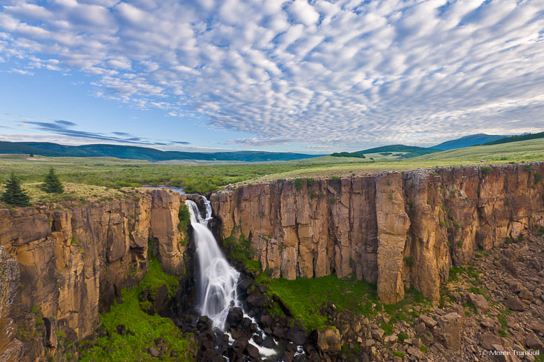 The morning clouds start to break over North Clear Creek Falls outside of Lake City, Colorado.