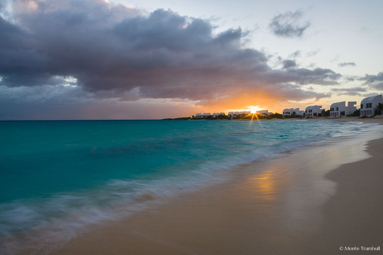 The setting sun shines its last light on Shoal Bay West in Anguilla, BWI.