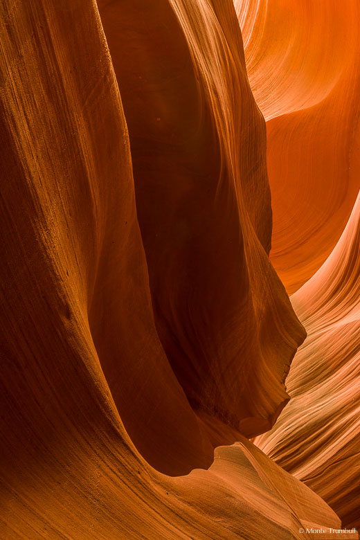 Layers of glowing red rock create the illusion of a demon's head in Lower Antelope Canyon outside of Page, Arizona.