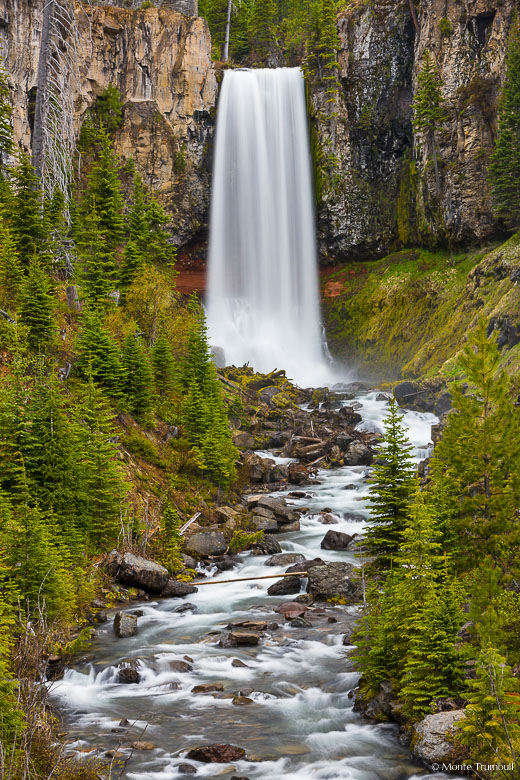 Tumalo Falls plunges over 80 feet from the top of a sheer basalt wall and drops into a narrow gorge outside of Bend, Oregon in the Deschutes National Forest.