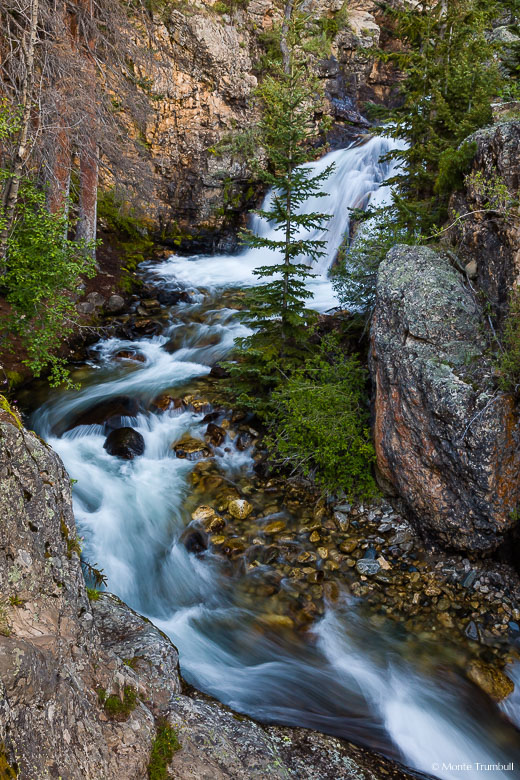 The North Fork South Arkansas River tumbles down Shavano Falls and makes a sharp turn through a narrow rocky canyon in the San Isabel National Forest in southern Colorado.