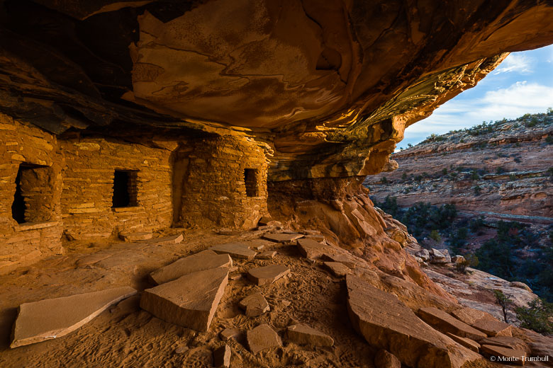 Late day light shines on the Fallen Roof Ruin overlooking the valley below in Cedar Mesa in southeastern Utah.