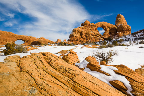 Turret Arch and the North Window on a sunny winter day in Arches National Park outside of Moab, Utah.